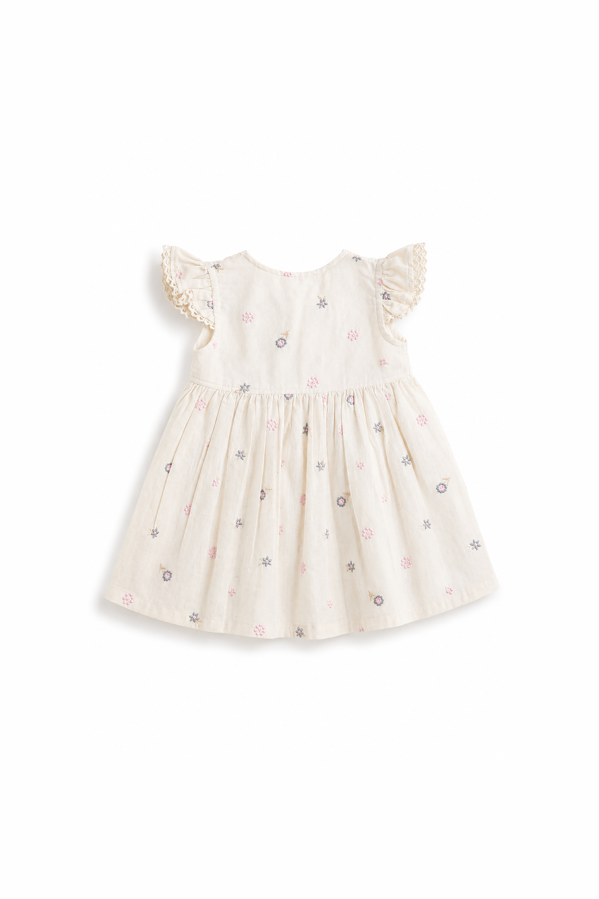 White baby dress with lace details on a white background
